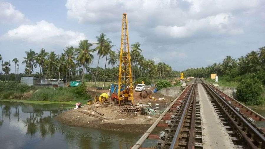Piling rig at a river crossing on a railway line